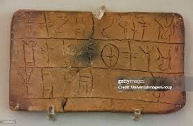 “Ancient Minoan Linear A script engraved on clay tablets”